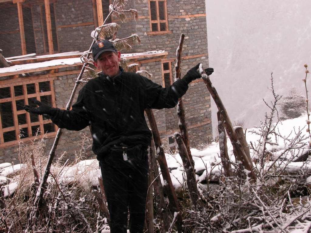 Annapurna 14 01 Snowing In Khangsar I woke up the next morning to heavy snow, the first bad weather of the trip. I knew the trek to Tilicho Lake to Jomsom was dangerous, so I had a tough decision to make. I could continue to Tilicho Base Camp and hope the weather clears tomorrow. If it doesn't we'll have to walk out, and probably miss my international flight. Or I could give up and walk out today. Then a little after 10am, a British couple, who were doing the same route and were camped an hour farther on the trail, passed by on their way down. They considered it too dangerous. I reread the description of the trek - sounds like life and death in snow. The route crosses three 5000+m passes and the trail itself is infrequently used and traverses some difficult terrain including steep, unstable scree slopes. If thickly covered with snow it is mountaineering terrain and the avalanche risk is correspondingly high. That did it. I would walk out. I left Khangsar at 11:15 and arrived at Hungde at 14:00. The sun came out amongst the clouds. I added my name to the waiting list, and now I, eh, wait.